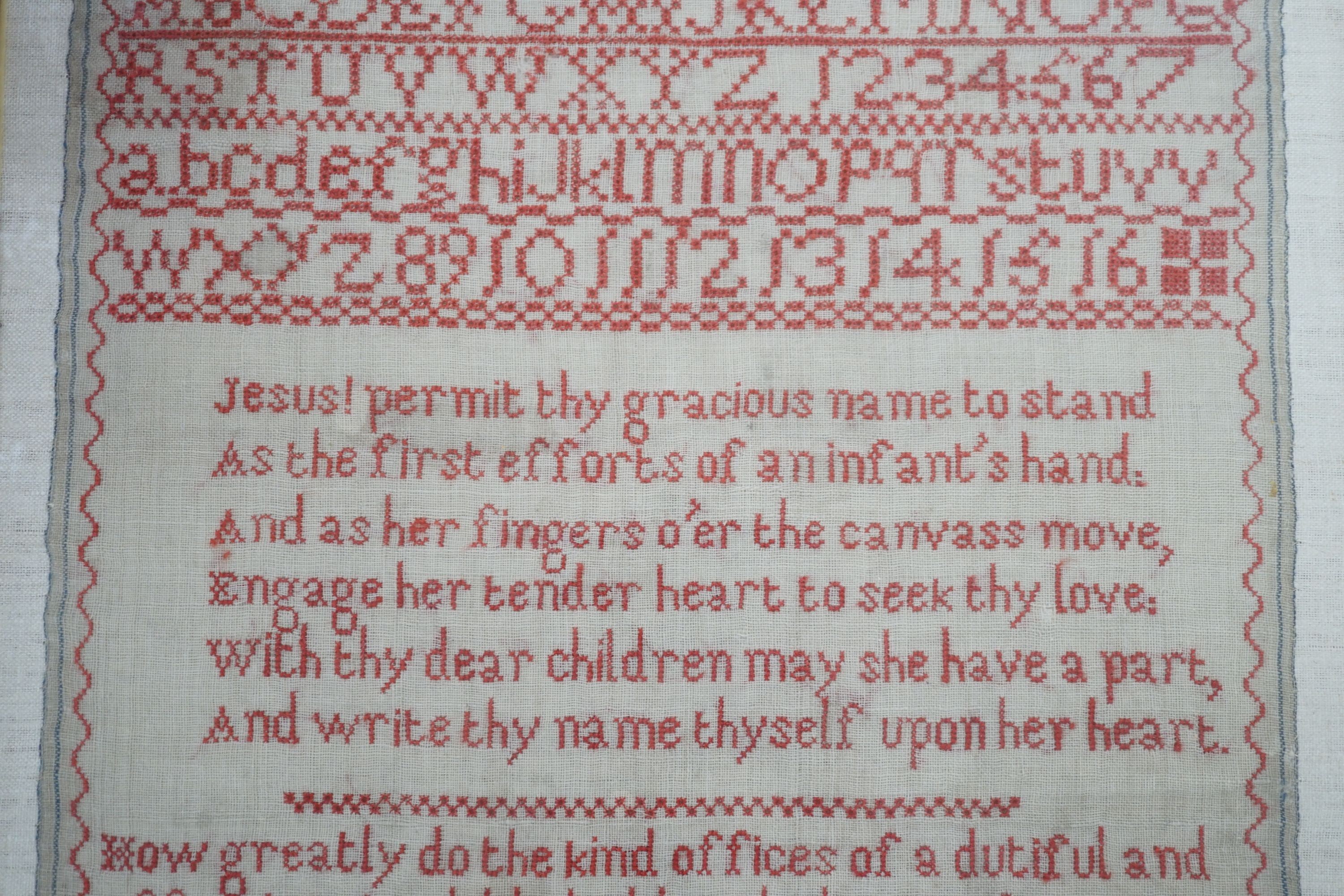 19th century red cross stitch sampler by Ann Reynolds, dated 1818, 34 cms wide x 42 cms high.